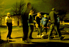 DR. BEAT Bboying / Breakdancing with young people in Wester Hailes on brick paving beside lit street light, fence and house at night